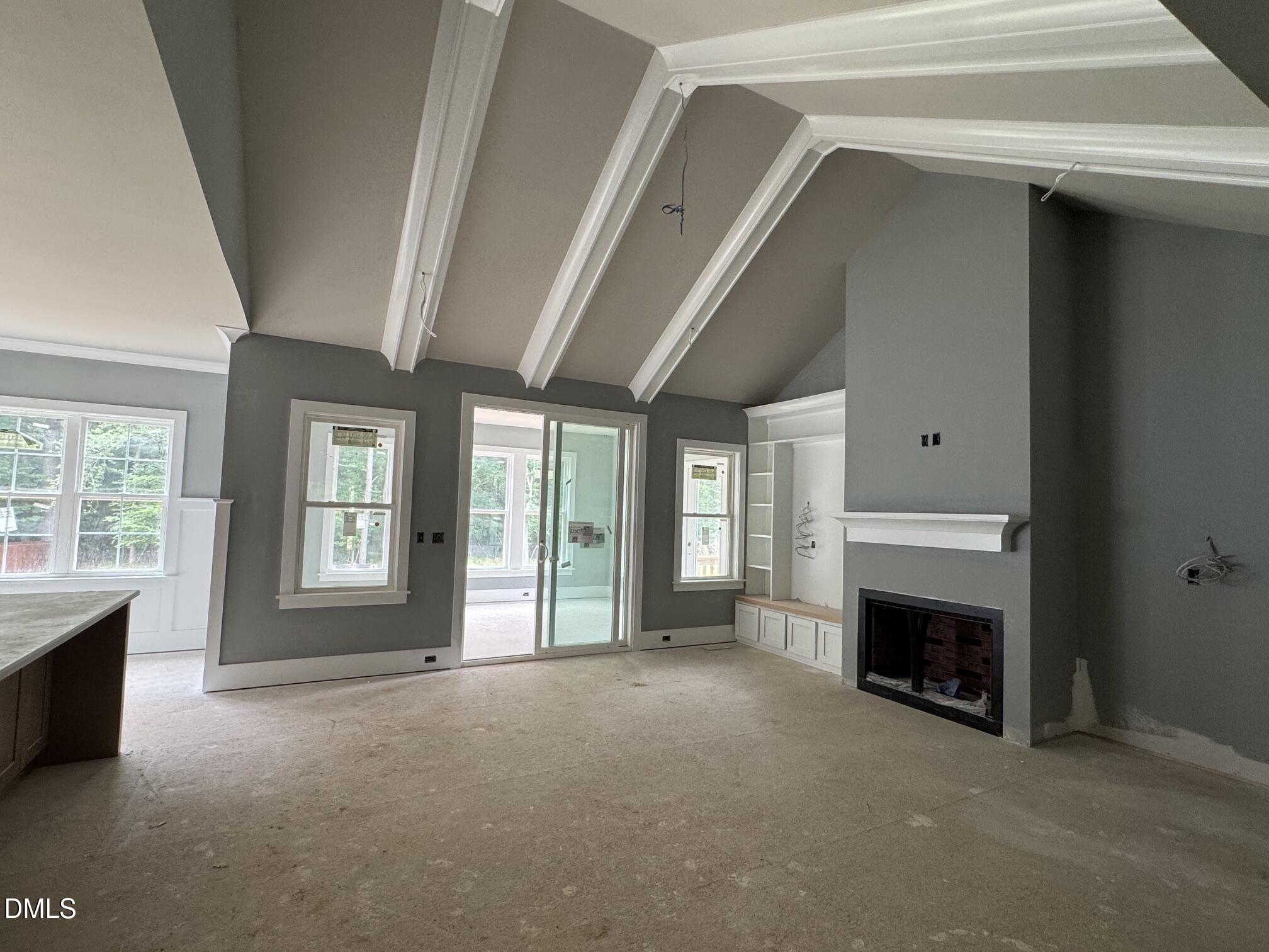 935 Lynch Road Selma, NC 27576 - Photo 19 of 21 a view of a livingroom with a fireplace and window