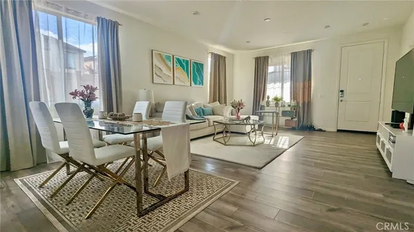 a living room with patio furniture and a window
