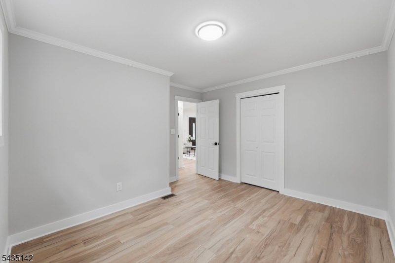36 Ruth Street Hopatcong, NJ 07874 - Photo 14 of 25 a view of an empty room and wooden floor