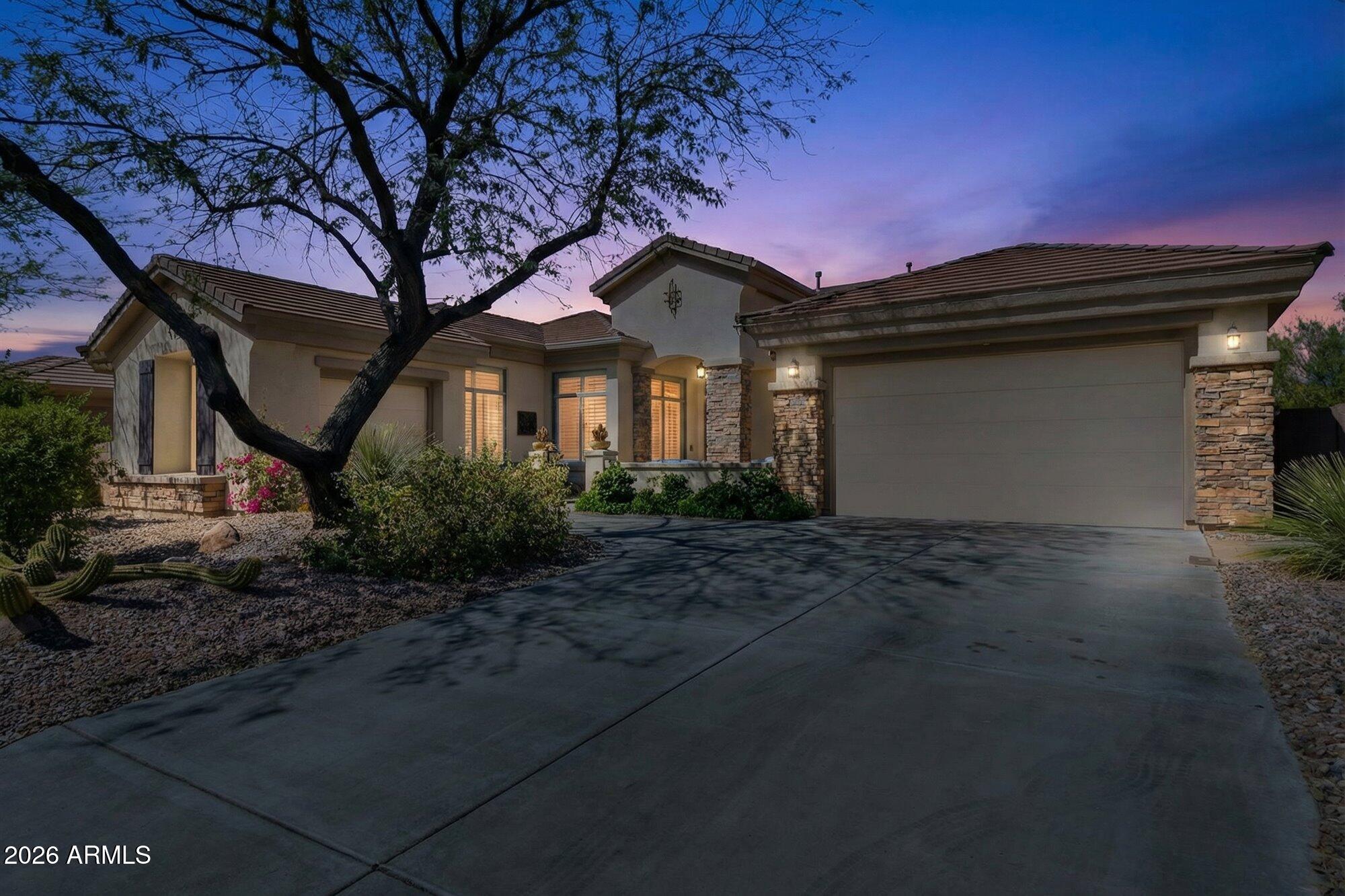 40118 North Lytham Way Phoenix, AZ 85086 - Photo 40 of 40 Evening shot of front