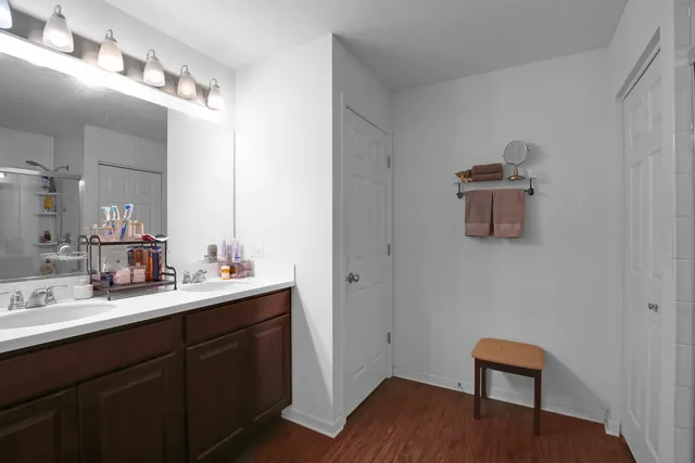 a en suite bathroom with a sink and a mirror