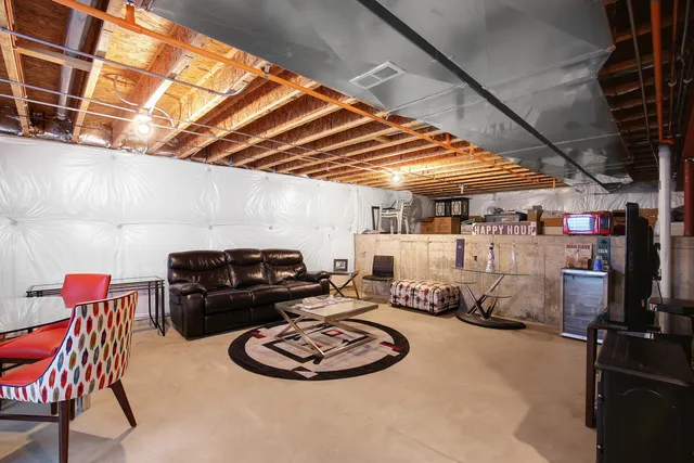 a room with furniture and a flat screen tv