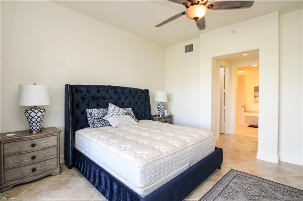 2713 Callista Court, Unit 103 Naples, FL 34114 - Photo 24 of 47 a large white bed in a white room