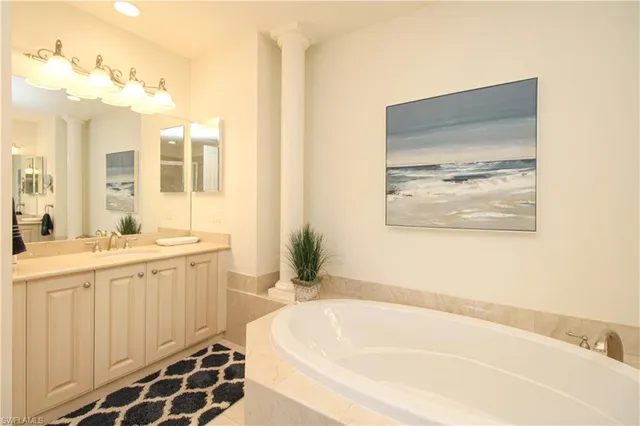 a bathroom with a bathtub and a sink