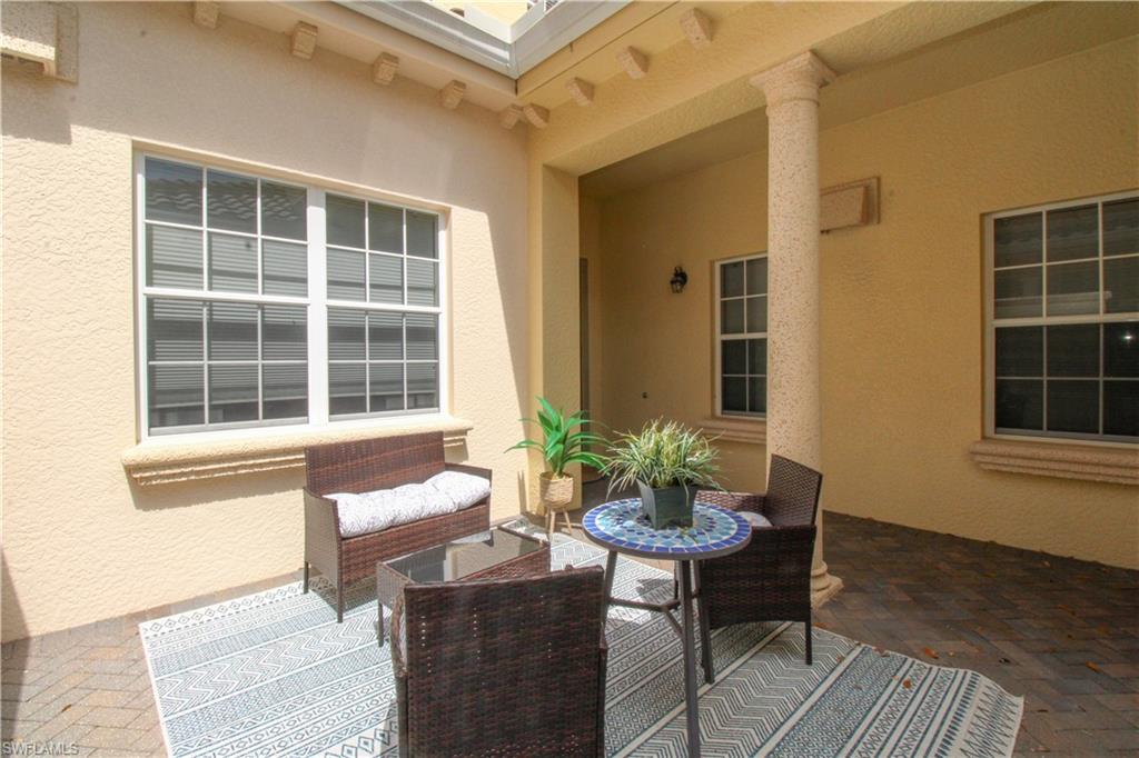 2713 Callista Court, Unit 103 Naples, FL 34114 - Photo 3 of 47 a living room filled with furniture