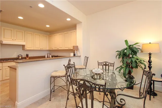 a kitchen with a table and chairs in it