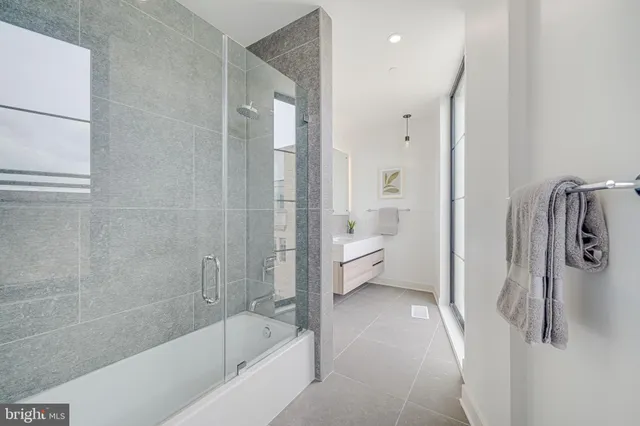a bathroom with a bathtub and a shower