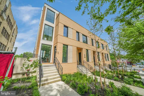 a view of a building with a yard