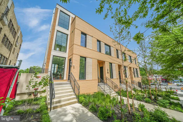 a view of a building with a yard