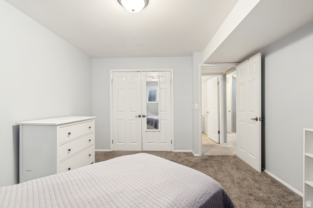 9832 Falconhurst Drive Sandy, UT 84092 - Photo 22 of 29 Room with light gray walls, plush gray carpeting, and a white flush-mount ceiling light fixture