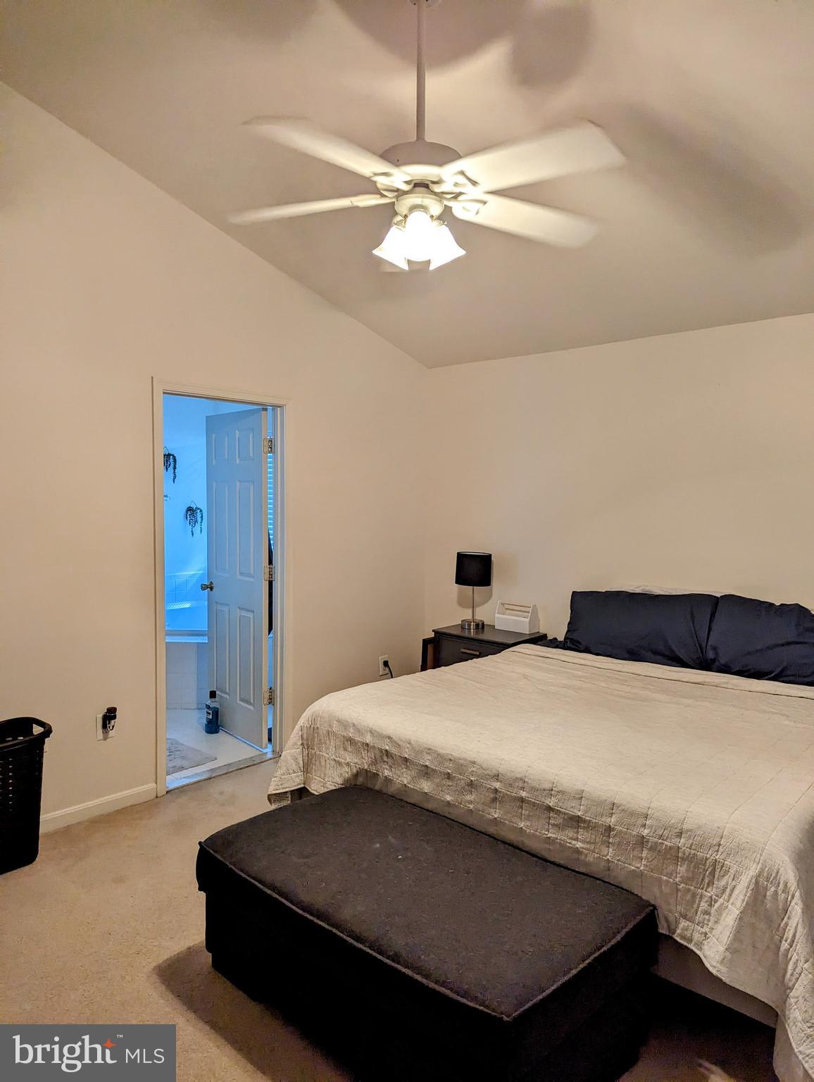 2701 Summers Ridge Drive Odenton, MD 21113 - Photo 23 of 50 a bedroom with a bed and a chandelier