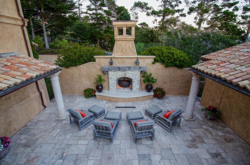 Padre Lane Pebble Beach, CA 93953 - Photo 13 of 25 a view of a patio with table and chairs with wooden fence and plants