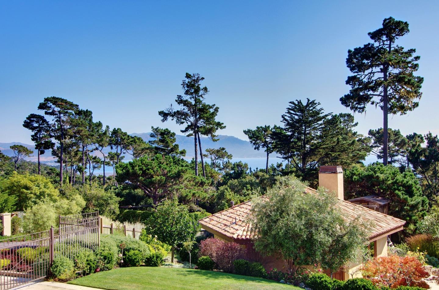 Padre Lane Pebble Beach, CA 93953 - Photo 17 of 25 front view of a house with a tree