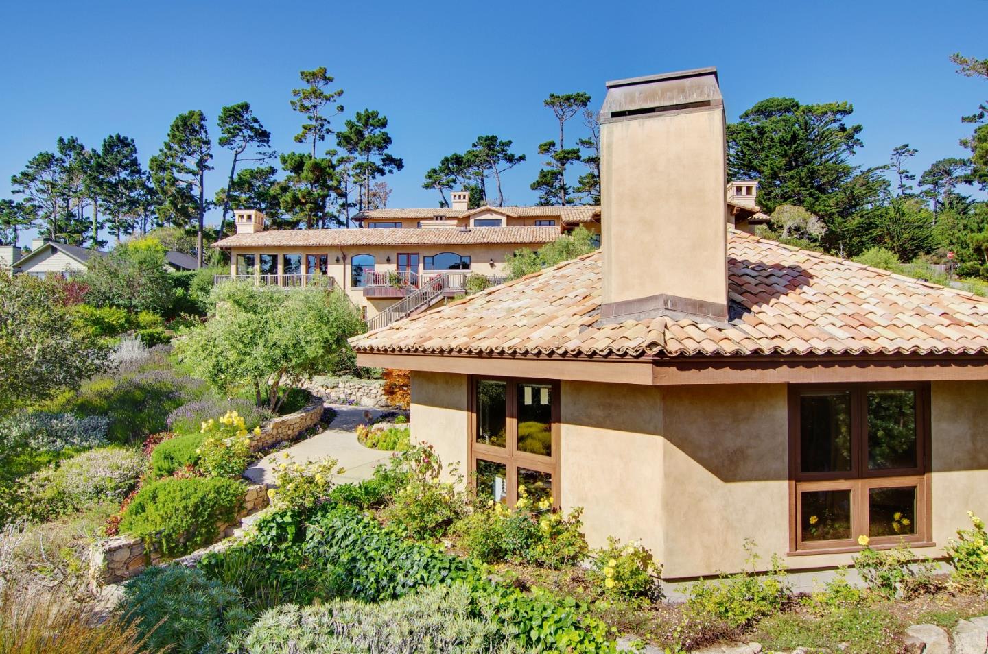 Padre Lane Pebble Beach, CA 93953 - Photo 23 of 25 a view of a house with a flower garden