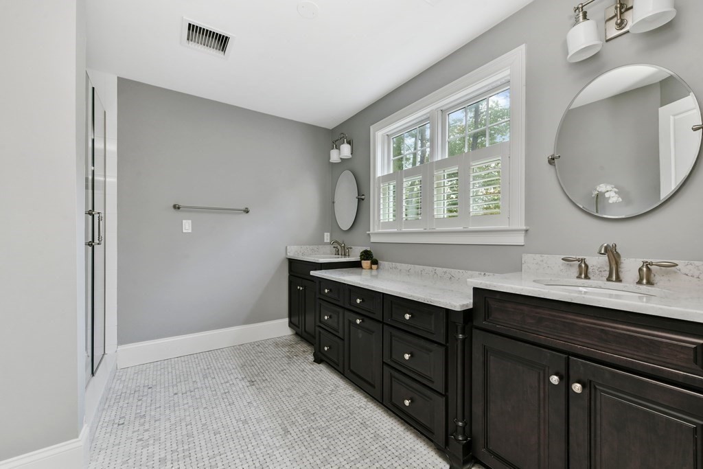 4 Fox Run Way Hingham, MA 02043 - Photo 17 of 34 a bathroom with a double vanity sink and a mirror