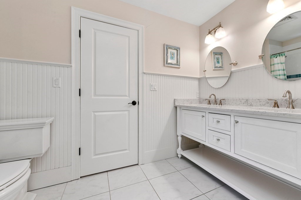 4 Fox Run Way Hingham, MA 02043 - Photo 19 of 34 a spacious bathroom with a double vanity sink and a mirror