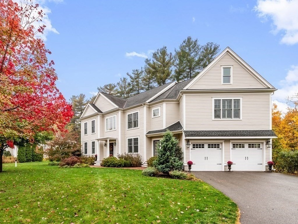 4 Fox Run Way Hingham, MA 02043 - Photo 2 of 34 a front view of a house with a yard and garage