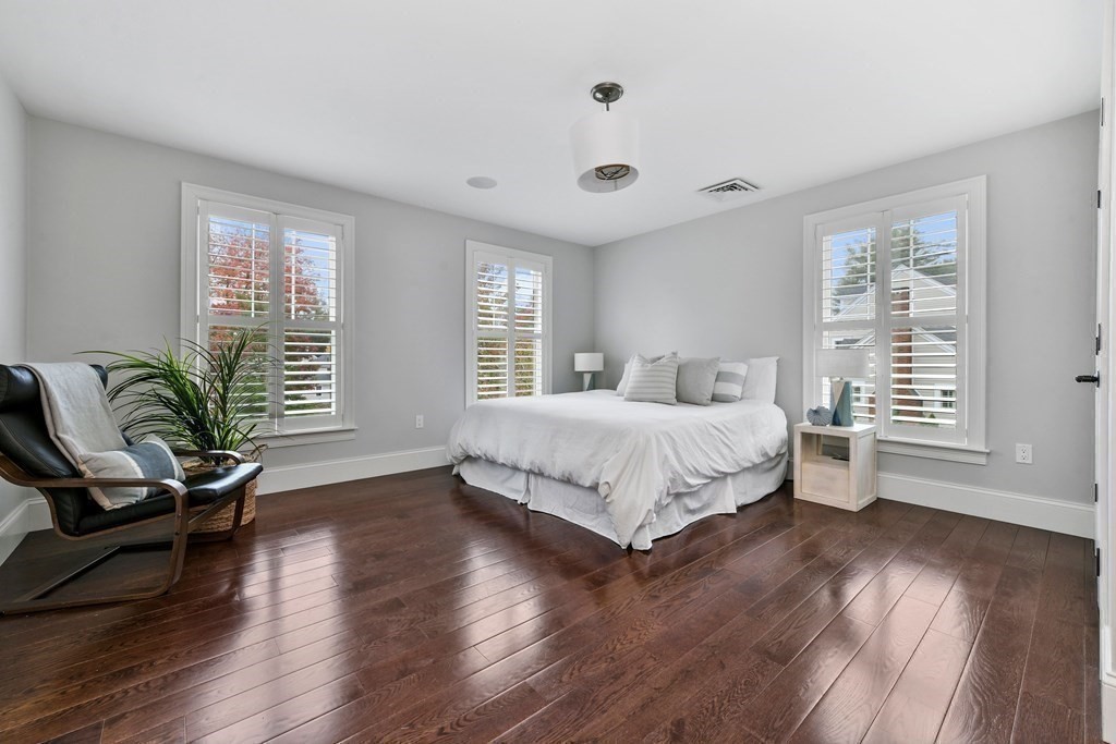 4 Fox Run Way Hingham, MA 02043 - Photo 22 of 34 a bedroom with a large bed and windows