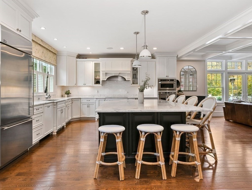 4 Fox Run Way Hingham, MA 02043 - Photo 3 of 34 a large kitchen with granite countertop a table chairs sink and cabinets