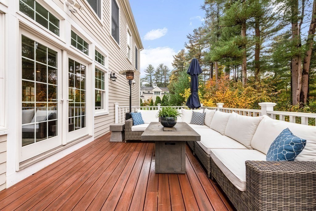 4 Fox Run Way Hingham, MA 02043 - Photo 31 of 34 a view of a balcony with couch and wooden floor