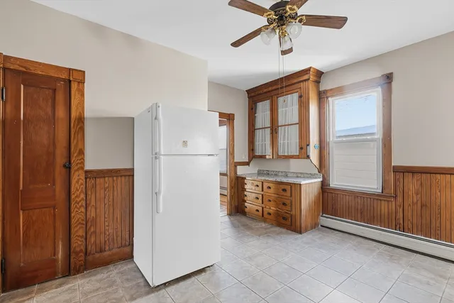 a kitchen with stainless steel appliances granite countertop a refrigerator and a stove