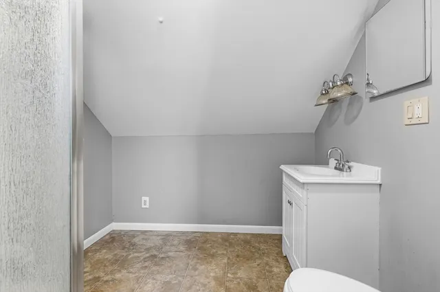 a bathroom with a sink a toilet