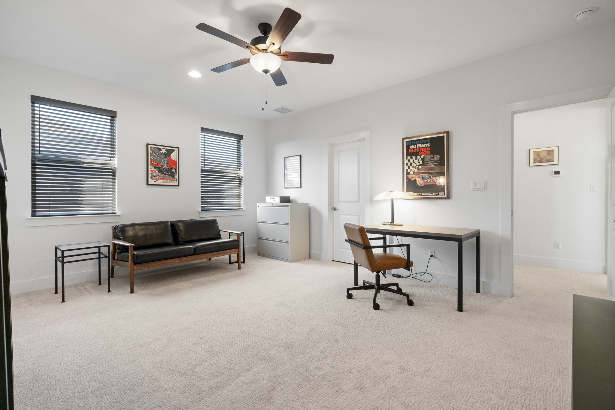 4704 Montorio Way Leander, TX 78641 - Photo 24 of 40 a living room with furniture and a ceiling fan
