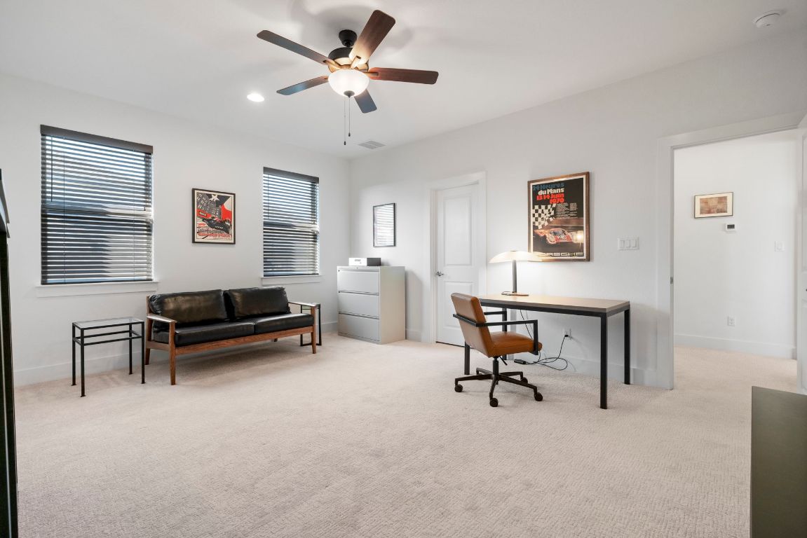 4704 Montorio Way Leander, TX 78641 - Photo 24 of 40 a living room with furniture and a ceiling fan