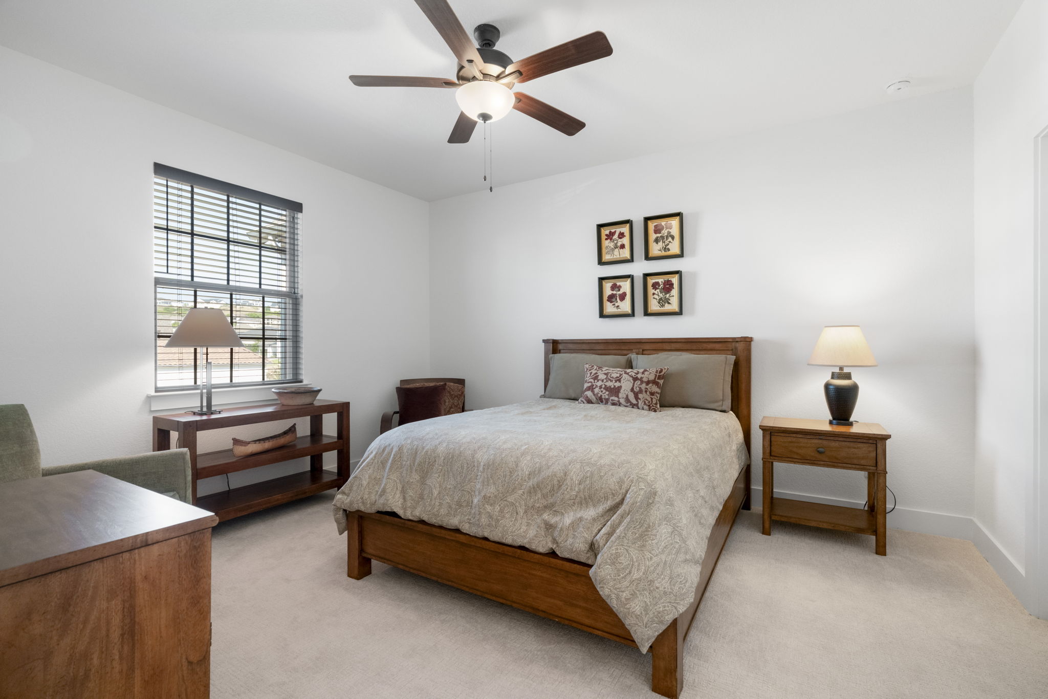 4704 Montorio Way Leander, TX 78641 - Photo 28 of 40 a bedroom with a bed and a chandelier