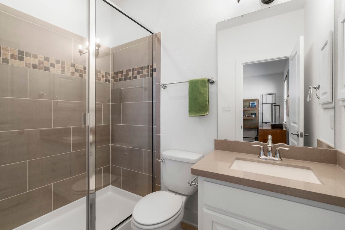 4704 Montorio Way Leander, TX 78641 - Photo 30 of 40 a bathroom with a sink toilet and shower