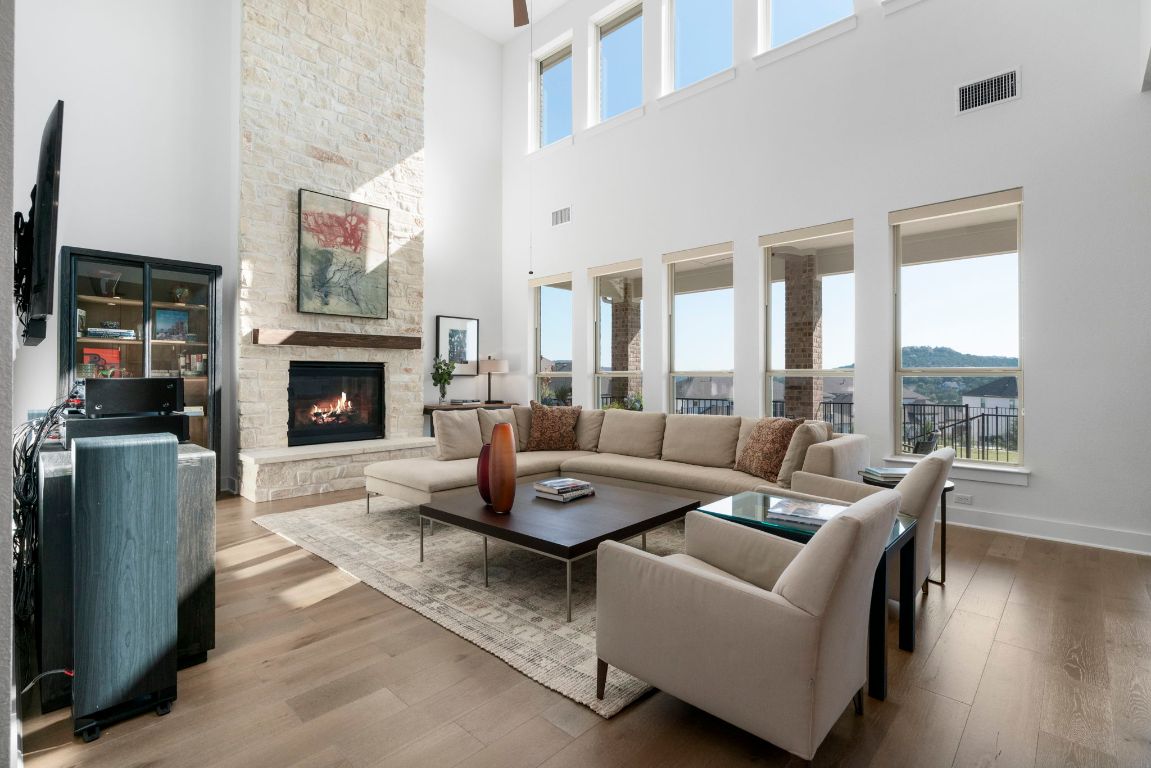 4704 Montorio Way Leander, TX 78641 - Photo 8 of 40 a living room with furniture and a fireplace