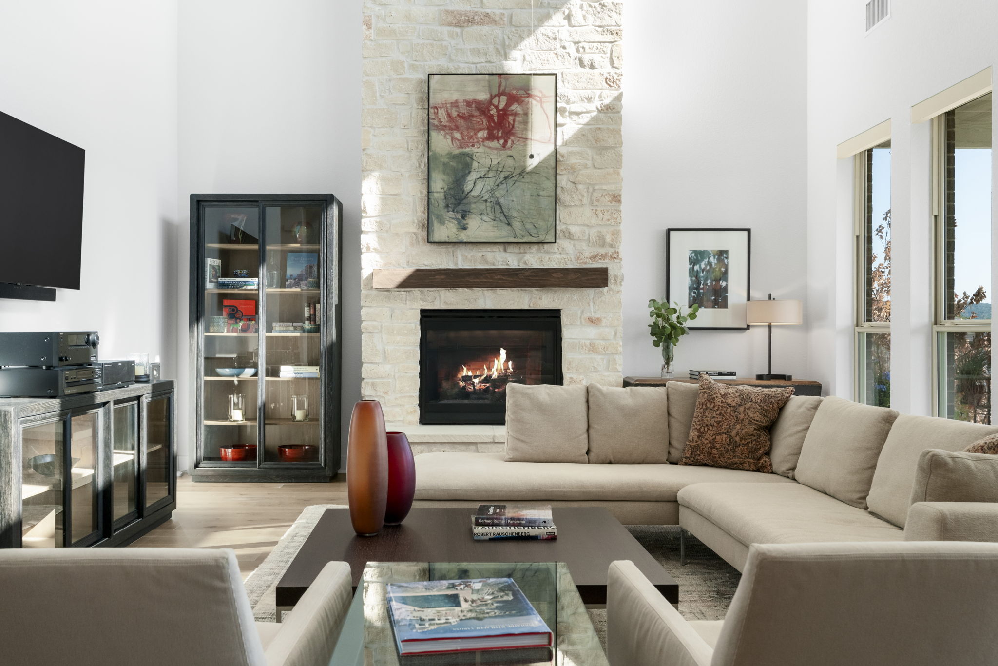 4704 Montorio Way Leander, TX 78641 - Photo 9 of 40 a living room with furniture a flat screen tv and a fireplace