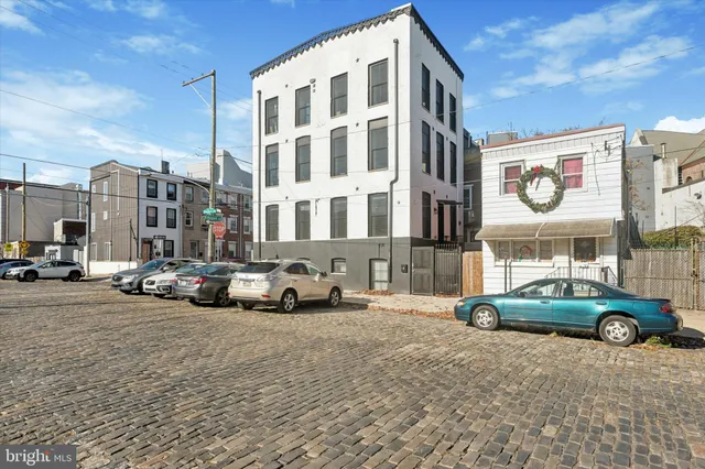 a view of cars parked in front of a building