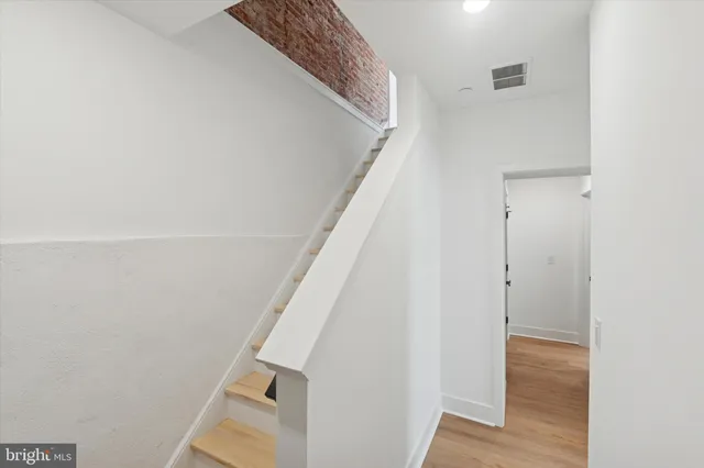 a view of entryway with wooden floor