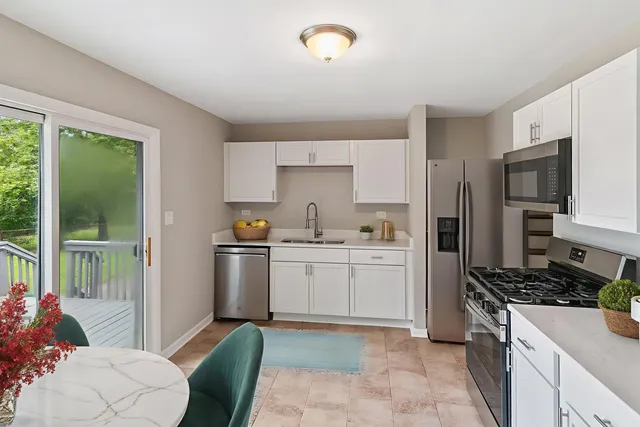 a kitchen with a sink stove and refrigerator