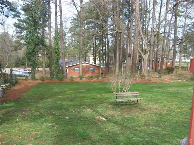 704 Oak Road Raleigh, NC 27603 - Photo 10 of 12 View of large fenced back yard from deck. Back Yard