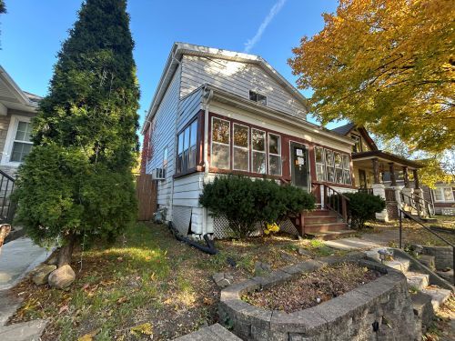 716 Wilcox Street Joliet, IL 60435 - Photo 2 of 15 a view of a house with a yard