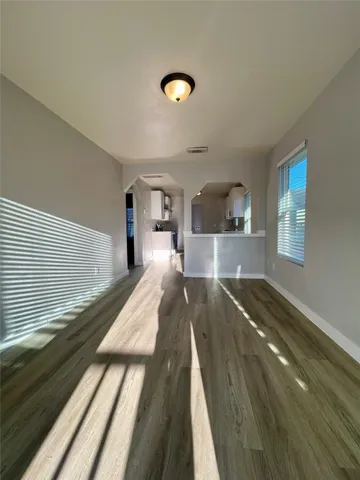 a view of a living room and wooden floor