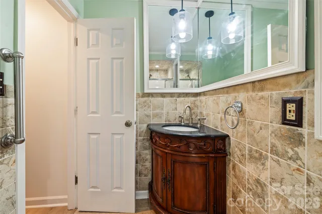 a bathroom with a toilet sink and window