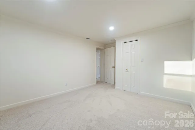 a view of an empty room and a window