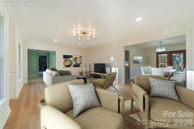 a kitchen with a table chairs stainless steel appliances and cabinets