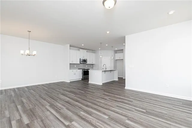 a view of kitchen with cabinets and wooden floor