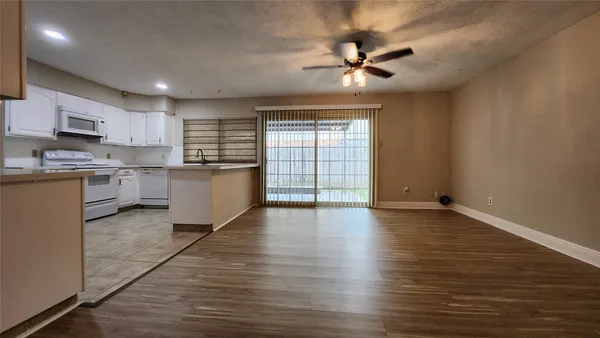 a view of a kitchen with a sink and a window