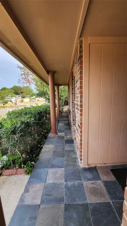 a view of a pathway both side of the house