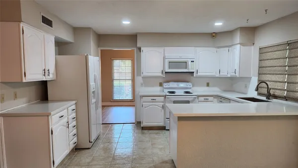 wooden floor in an empty room with a fireplace