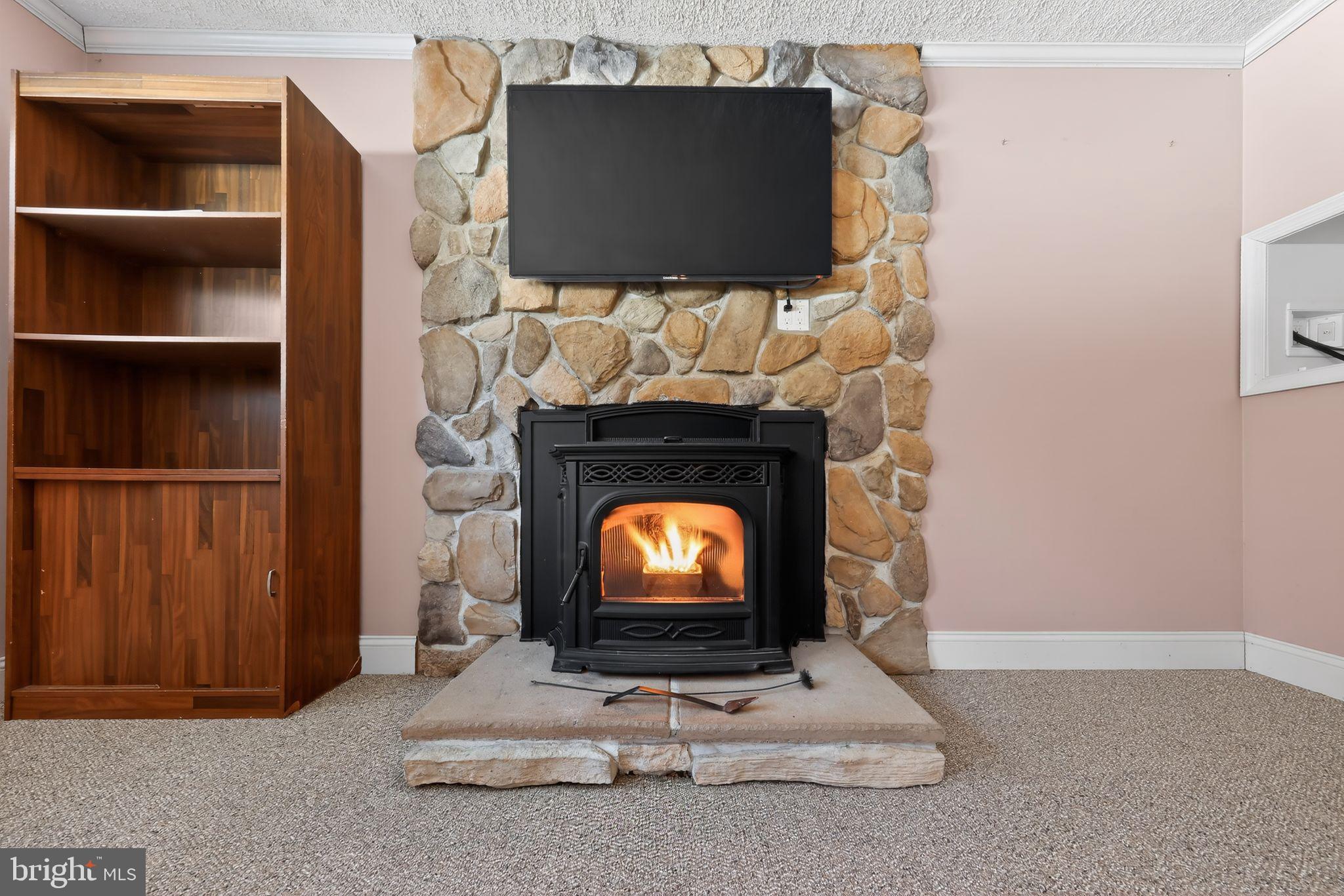 715 Darley Road Claymont, DE 19703 - Photo 12 of 43 Cozy fireplace with stone accent wall.