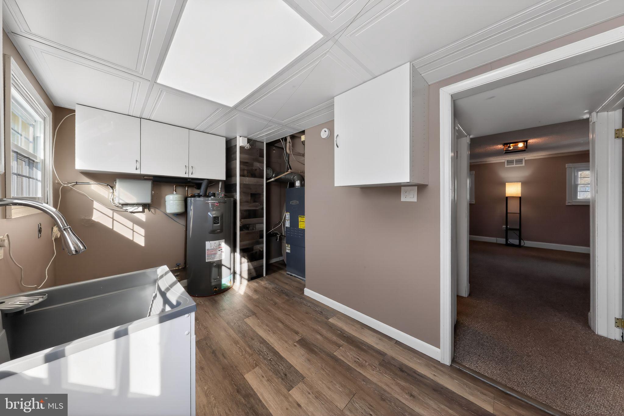 715 Darley Road Claymont, DE 19703 - Photo 17 of 43 Renovated laundry room with sink & utility space