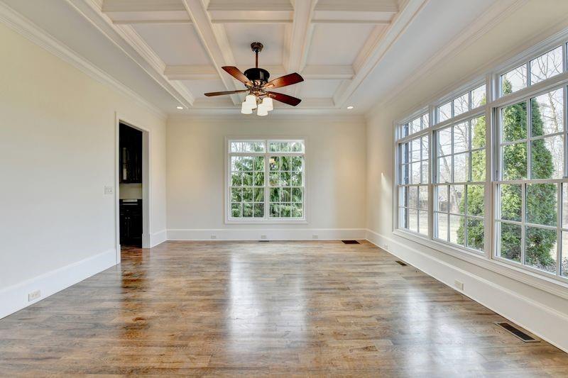 4045 Ridge Road Buford, GA 30519 - Photo 9 of 97 a view of an empty room with wooden floor and a window