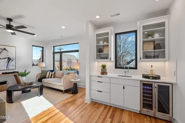 a bathroom with a sink a toilet and a window
