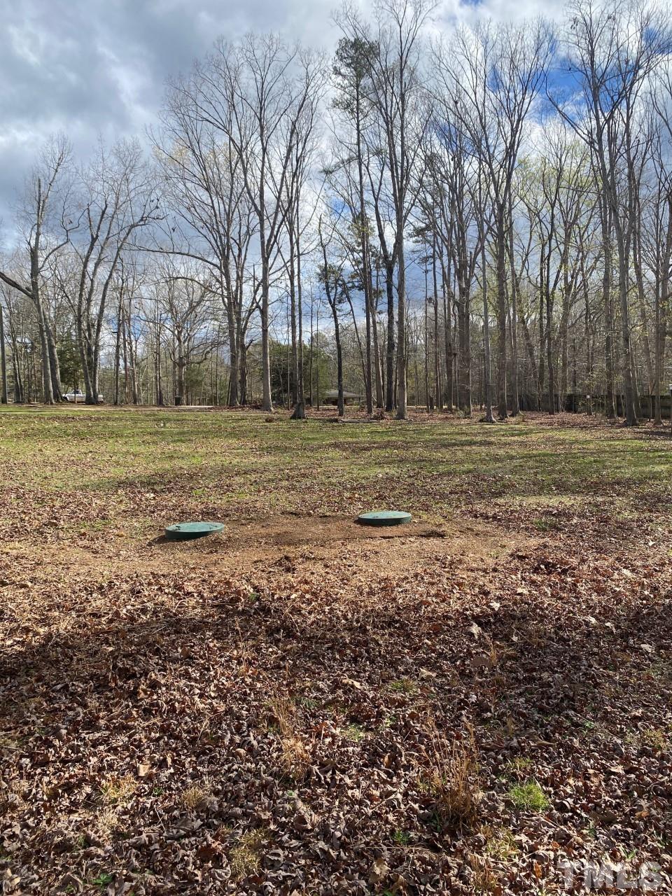 519 Goodwin Road Durham, NC 27712 - Photo 17 of 18 a view of dirt field with trees